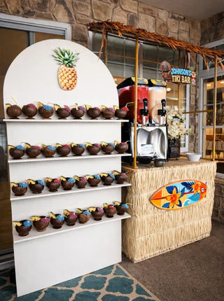 Tiki-themed bar with coconut drinks and a pineapple decoration.
