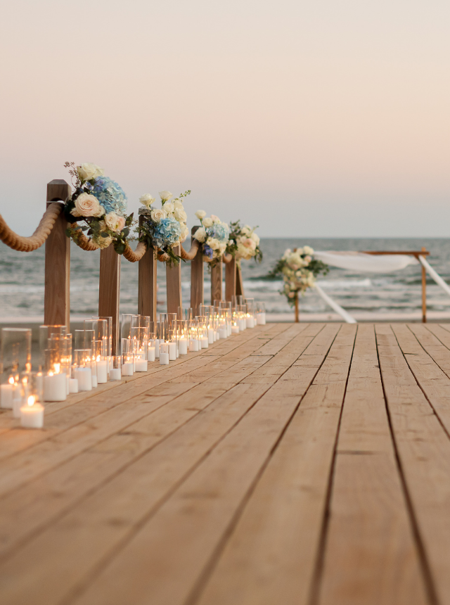Floral candlelit seaside deck setup
