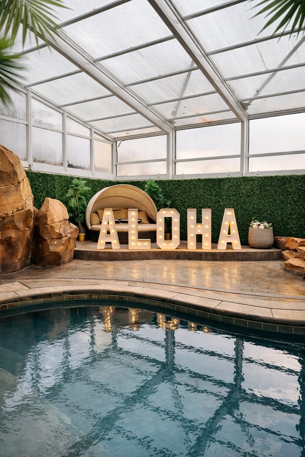 ALOHA sign poolside rock decor